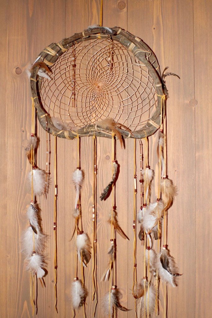 Things Helen Loves, dreamcatcher on wooden wall in lodge, Pairi Daiza Belgium